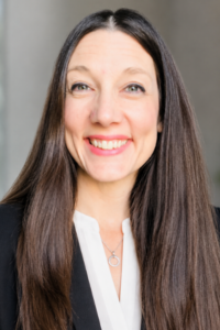 Headshot of Sarah Bleiler-Baxter against a neutral background